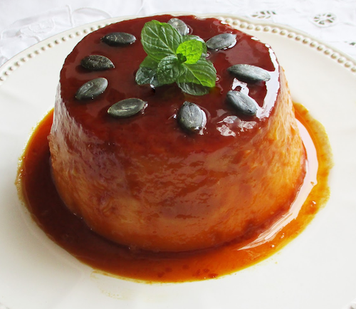 a full pumpkin flan with caramel presented in a dish